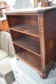 An Edwardian mahogany bookshelf of small proportions having inlaid decoration