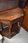 An early 20th Century hall table , opening out to form an octagonal top