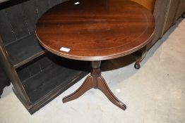 A reproduction Regency style occasional coffee table having circular top, diameter approx. 57cm