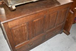 A Georgian oak kist having four panels over two drawers, on bracket feet, width 126cm