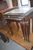 A reproduction nest of three occasional tables