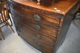 A 19th Century Regency style bow fronted chest of two over three drawers, on bracket feet, width