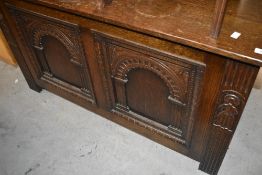 An early 20th Century bedding box having lift lid and arch panels, width approx. 115cm