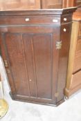 A 19th Century oak corner cupboard, height approx. 115cm