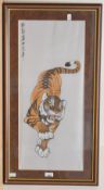 A 20th century Chinese painting on silk, depicting a tiger with Chinese characters upper left,