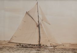 After Ian Badley (British contemporary) a monochrome photographic print of a yacht, signed lower