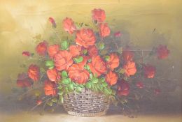 A 20th century oil on canvas, still life study-basket of roses, bearing signature Alan.T lower