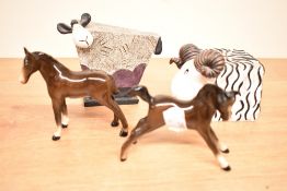 An Art Forum stylised Ewe and Ram sold along with two Beswick foal studies.
