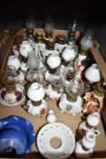 A large collection of assorted miniature ceramic oil lanterns etc.