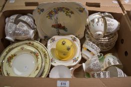 Two vintage dessert sets one having a 1920's inspired decoration and the other floral swags on a