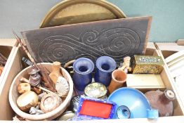 A large brass tray, a carved wooden panel, a wooden bowl and selection of smaller wooden items, a
