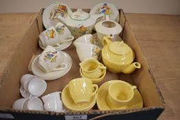 Two childrens tea services one having nursery rhyme characters and the other having a geometric