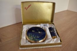 A vintage Stratton powder compact set with matching lipstick holder in original box and featuring