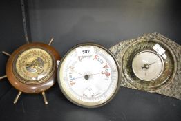 A partially turned and polished serpentine mantel barometer 15cm sold along with a decorative