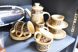 An attractive 1970's J&G Meakin coffee set for six, mottled beige with repeating stylised floral