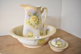 A B & K Ltd water jug, bowl and soap dish set in cream with yellow rose decoration having some