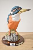 A large Leonardo Collection porcelain Kingfisher on wooden plinth, measuring 29cm tall.