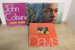 A six album with Miles Davis and John Coltrane recordings on offer here