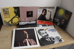 A sixteen album lot of various jazz albums as in photos - more trad / old time than modern with