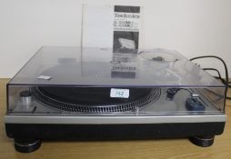 A Technics SL1200 MK II DJ turntable - direct drive and still in demand - solid , well made and