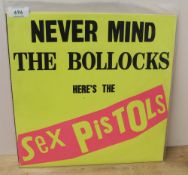 A copy of the Sex Pistols ' Never mind the B*llocks ' being the rare ' no track list ' to rear
