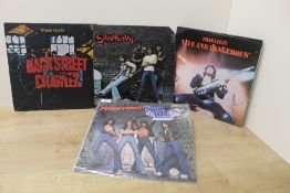 A four album rock lot with Thin Lizzy and more as per photos
