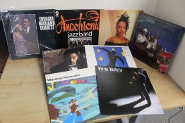 A sixteen album lot of various jazz albums as in photos - more trad / old time than modern with