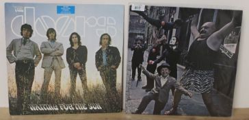 A lot of two later Doors pressings as in photos - showing the lightest of sleeve wear