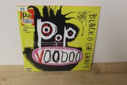 A copy of Black Grapes ' Pop Voodoo ' sealed yellow vinyl 2017 press / Madchester / Happy Mondays