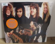 A copy of Metallica's ' Garage Days EP - orange translucent vinyl - sealed 12' - Mint