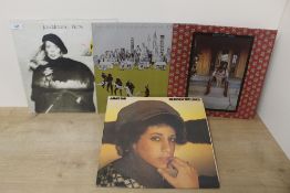 A lot of seven albums - Lennon , John Mitchell , Janis Ian and more - as in photos