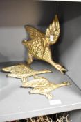 A set of 3 brass graduating flying ducks, largest H26cm