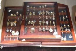 3 mahogany and glass fronted display cases containing collectable souvenier spoons, to include