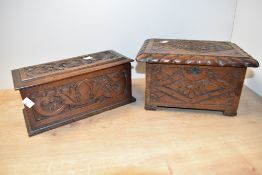 Two early 20th century carved oak boxes, each of hinged rectangular form and carved with traditional
