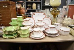 A Melba fine bone china tea service decorated in the Art Deco style having red geometric patterns on