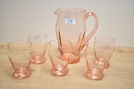 A pink glass lemonade set, comprising of a pitcher h19.5cm, and 5 matching glasses, (6)