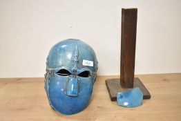 An early 20th century ceramic reproduction Angelo Saxon helmet having suspended parts in a blue
