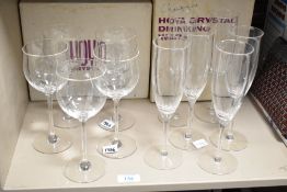 Two boxes containing Hoya crystal glasses, comprising of 5 large wine glasses and 6 champagne