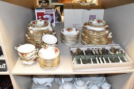 A Royal Albert Old Country Rose pattern part dinner service decorated with gilt edge and floral
