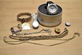 A small collection of costume jewellery, including a white metal hinge buckle motif bracelet and