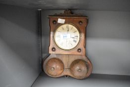 An early 20th century Wurttemberg wall clock, the dial having Roman numerals, label to the back