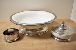 An Italian 'Arte Italica' metal mounted white ceramic bowl with circular foot, 37.5cm diameter, sold