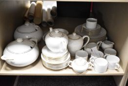 A Harmony fine bone china part dinner service, decorated with gold colour edge and border on a white