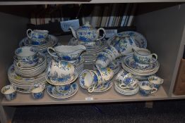 A Masons Regency pattern ironstone dinner/tea service decorated with blue, yellow and red foliage on
