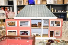 A modern wooden two storey Dolls House, height 55cm, length 66cm, depth 25cm, modern wooden
