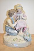 An early 20th century German painted ceramic figure of a boy and girl, h37cm