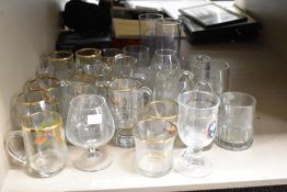 A job lot of glass tankards and sherry glasses, to include a Vale Lodge Mason glass and a half