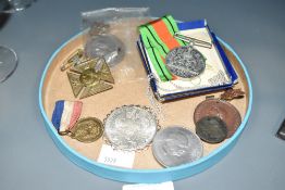A group of military medals and coins, to include a Queen Victoria 1887 Golden Jubilee Maltese Cross,