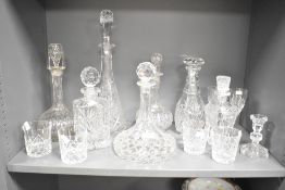 A group of cut crystal decanters, largest h43.5cm, sold together with 4 tumblers, 2 wine glasses and