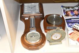 A Smith oak cased 8-day combinationwall clock, having temperature and barometer gauge, 50cm, sold